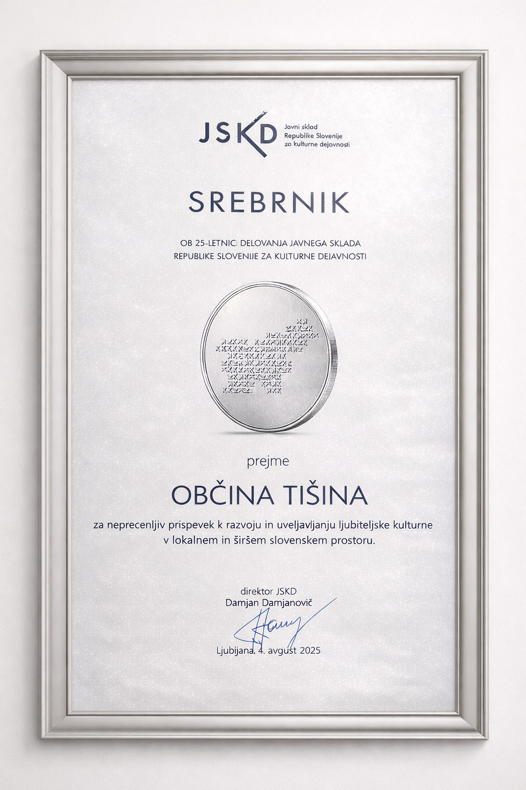 Srebrnik JSKD v okvirju